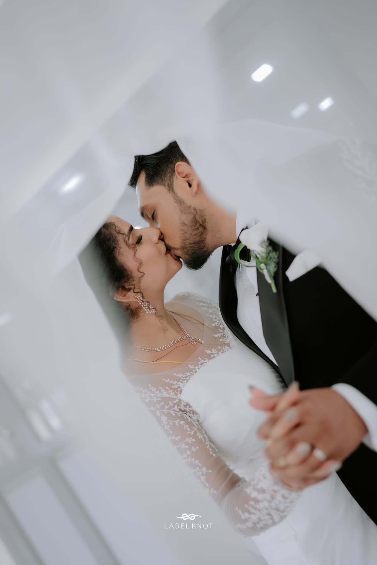 Elizabeth and Freddy sharing a kiss on their wedding day