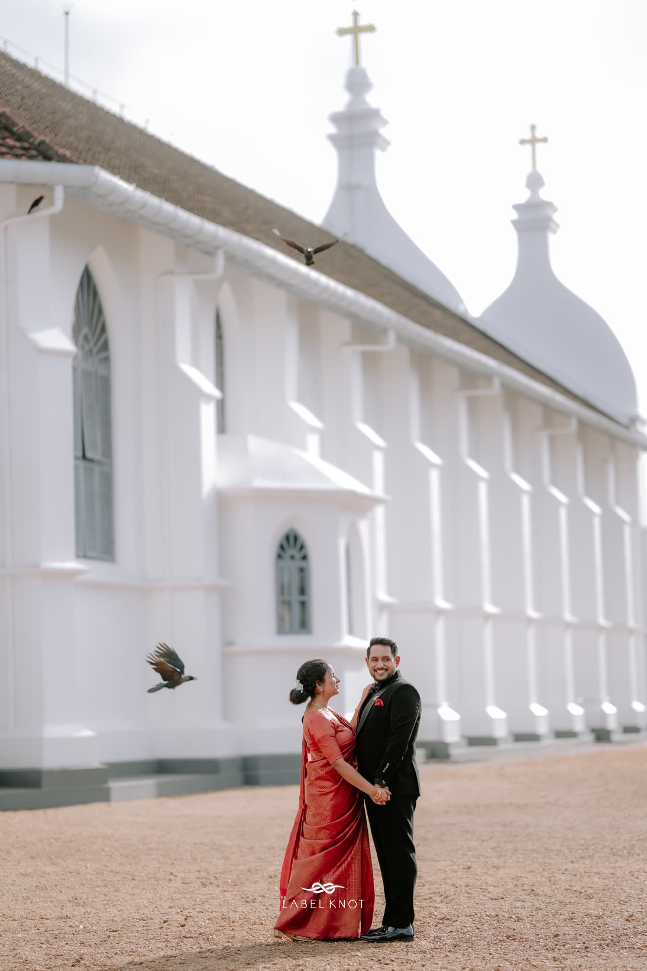 Elizabeth and Freddy standing together outside the church